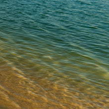 Load image into Gallery viewer, Photography by Ana Sosa that is a reflection of nature with terracota, aqua and yellow tones  over the lake