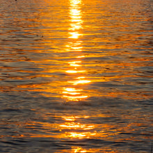 Load image into Gallery viewer, Mgical moments painted by the setting sun over the serene waters of Willard Bay Reservoir, photography by Ana Sosa