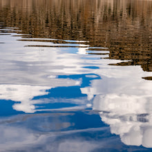 Load image into Gallery viewer, A masterpiece photograph that captures the serene dance between the calm waters and the vivid blue sky, by Ana Sosa