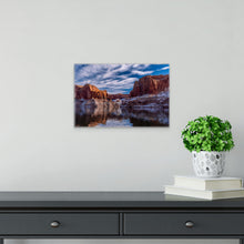 Load image into Gallery viewer, "Snow Wonderland 16" x 24" - A captivating scene paired with books and a vase for a stylish decor touch."