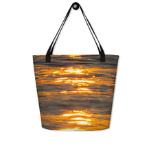 Load image into Gallery viewer, A Photo of orange reflection all over print on a large tote bag. Close up hanging with black strap. Showing the other side of the bag