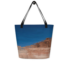 Load image into Gallery viewer, A tote bag, seen from another side, completely printed, blue sky and rock formations reflected on the water.