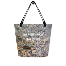 Load image into Gallery viewer, Back of tote bag features a stunning underwater rock print and the message "Save water, every drop counts." Made from durable materials, it is perfect for everyday use.