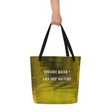 Load image into Gallery viewer, Back side of an elegant and ecological Tote Bag: perfect balance between yellow and green that contains a legend of conserving water in every drop.