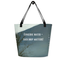 Load image into Gallery viewer, tote bag features a unique design that reflects the beauty of winter and the importance of conserving water. With the message "every drip matters" and a reminder to use water as needed, it is both stylish and educational