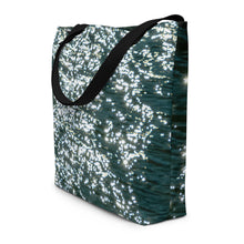 Load image into Gallery viewer, A beautiful tote bag with a brilliant reflection on the turquoise water.  Black handle and side view to show seams of the printed sides
