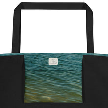 Load image into Gallery viewer, A modern tote bag, seen from the inside. Inside bag printed with turquoise and terracotta waves, plus Ana's CameraWork logo