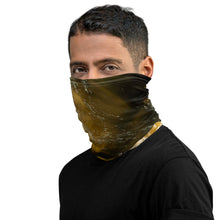 Load image into Gallery viewer, A man wearing a gaiter with an all-over terracotta-colored print, seen from the left side.