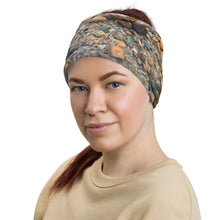 Load image into Gallery viewer, Neck Gaiter used as a band, printed with an image of beautifully colored underwater rocks, modeled on blonde hair