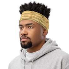 Load image into Gallery viewer, Neck Gaiter Made with a vibrant yellow and green Reflection print, a versatile accessory that can be used with a headband. Shown on a black man