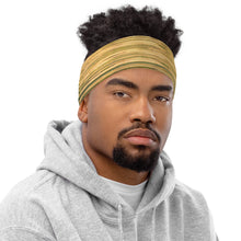Load image into Gallery viewer, Beatifull contrast of a Neck Gaiter Made with a vibrant yellow and green Reflection print, a versatile accessory that can be used with a headband. Shown on a black man
