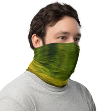 Load image into Gallery viewer, A male model wearing a versatile neck gaiter that he wears to cover his face, side view.