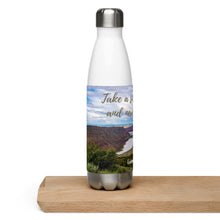 Load image into Gallery viewer, Stainless steel water bottle white 17 oz. On shelve, right side view with Flaming Gorge Reservoir and 'take a sip of energy and never give-up' printed.