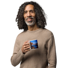 Load image into Gallery viewer, A man with a white glossy 11 oz mug with Pineview Reservoir image, handle on left.
