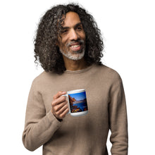 Load image into Gallery viewer, A man with a white glossy 15 oz mug with Pineview Reservoir image, handle on left