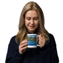 Load image into Gallery viewer, A woman with a white glossy 15 oz mug with Mantua Reservoir image. Handle on right