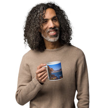 Load image into Gallery viewer, A man with a white glossy 20 oz mug with Pineview Reservoir image, handle on left