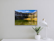 Load image into Gallery viewer, "'Exploration Essence' 16" x 24" - Enhancing a beige wall alongside a table adorned with a lamp and a planter featuring a vibrant green plant, conjuring a serene and adventurous ambiance."
