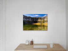 Load image into Gallery viewer, "'Exploration Essence' 24" x 36" - Enhancing a beige wall in a study with a wooden desk, a white laptop, a mug, and a white clock, conveying the spirit of adventure in a workplace setting."