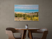 Load image into Gallery viewer, "'Enchanting Hues' 24" x 36" - Enhancing a polished dining area with a similar brick wall, a table for two with leather chairs, and an atmosphere of elegance."