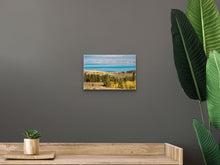 Load image into Gallery viewer, "'Enchanting Hues' 8" x 12" - Intimate beauty in the same setting as the previous, showcasing the artwork's size harmony with wooden furniture."