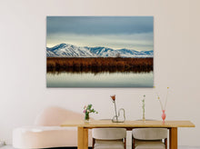 Load image into Gallery viewer, 'Stillness - Limited Edition Fine Art Print' - 40"x60" displayed on a soft pink wall in a modern reception area with a small wooden desk.
