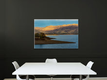 Load image into Gallery viewer, 'Sunset Over The Mountains' - 24"x36" hanging on a black wall in a corporate meeting room with white furniture, creating a contrasting and elegant atmosphere.