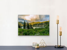 Load image into Gallery viewer, •	" Vibrant Rainbow 16" x 24" - A refined touch for your space, comparing the print's size to a table lamp for scale."