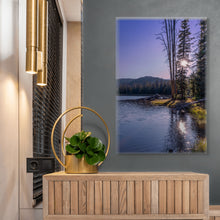 Load image into Gallery viewer, A limited edition 36&quot;x24&quot; portrait, titled &#39;A Ray of Light Through the Pine Tree&#39;, a beautiful image with twilight colors displayed on a gray wall next to a tan counter.
