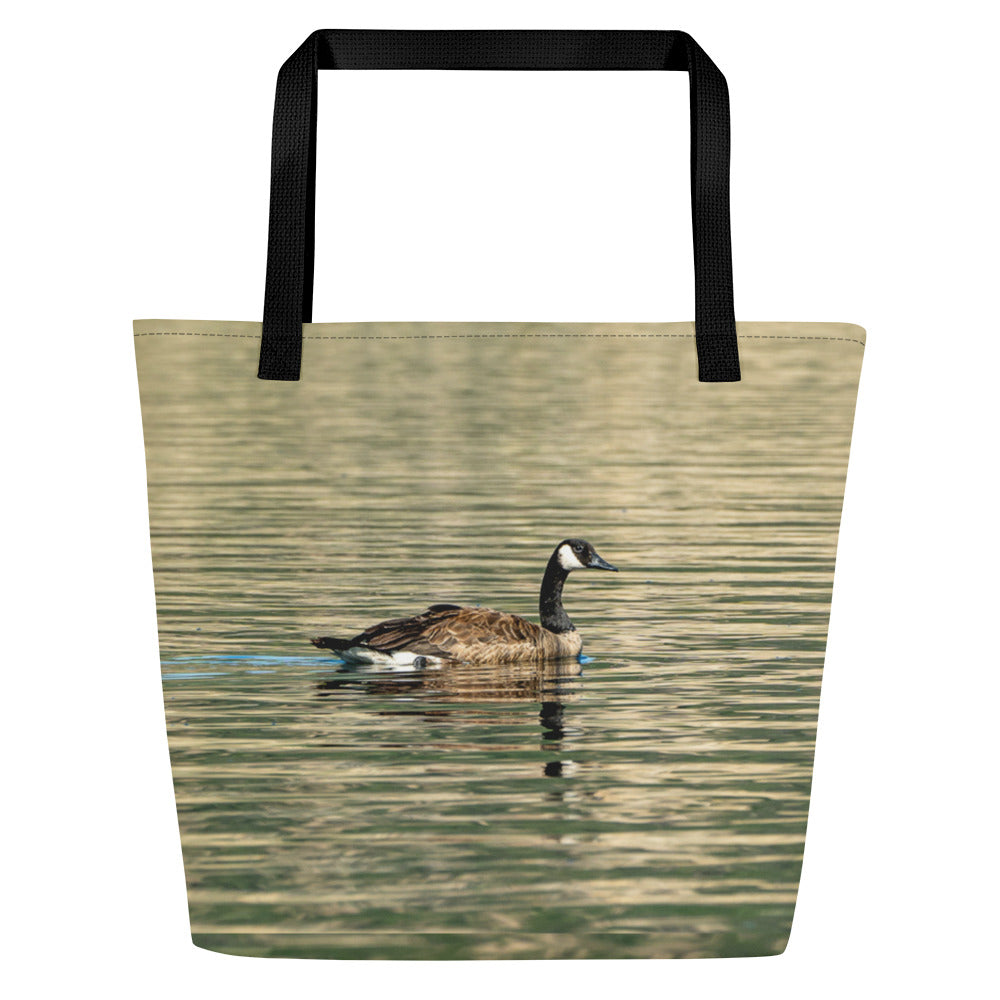 Tote bag all over print with a duck swiming in green water reflection