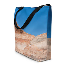 Load image into Gallery viewer, A modern tote bag, seen from the side, showing details. Printed completely, blue sky and rock formations.
