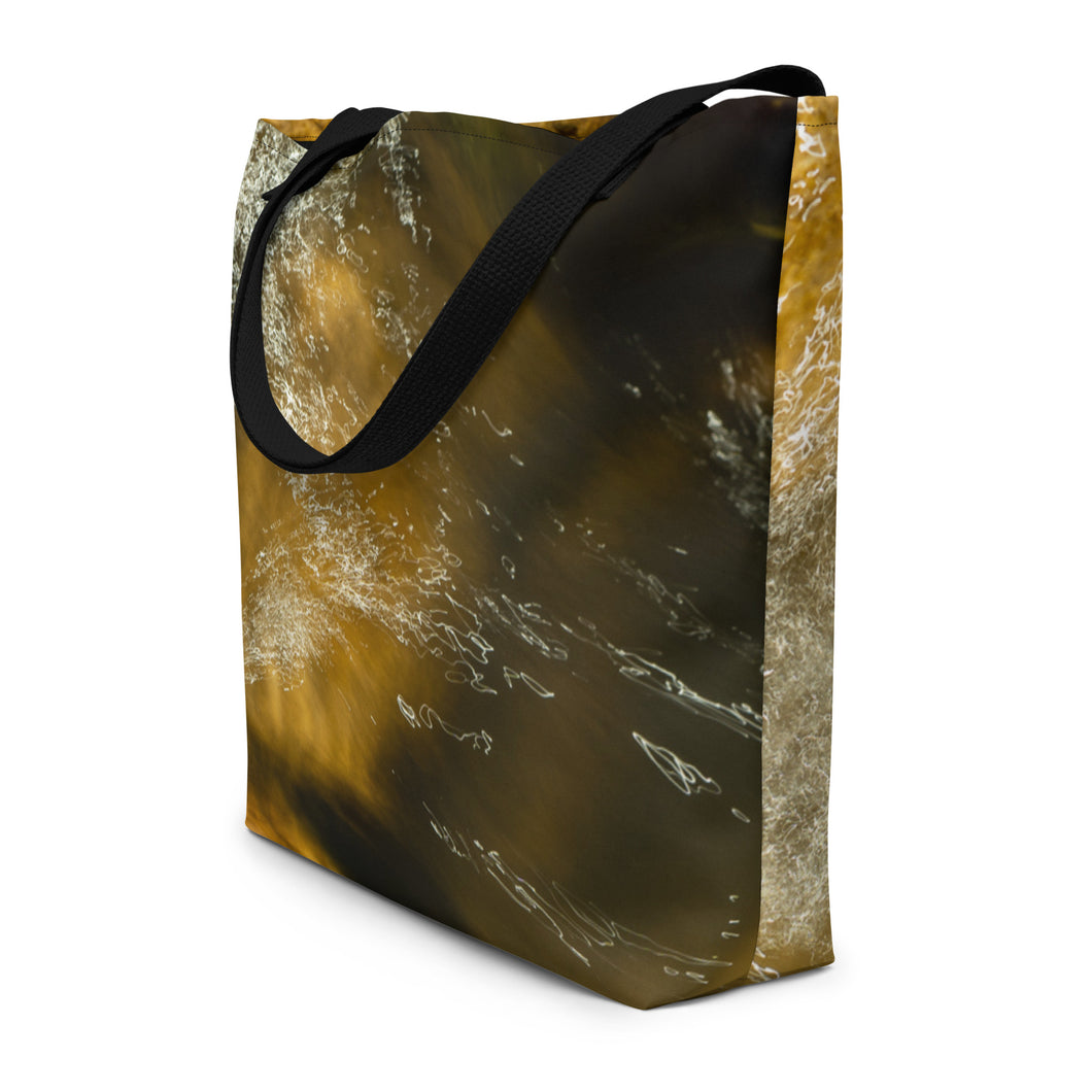 Tote bag with all-over print, vibrant terracotta under water colors. Displayed laterally to show details, with black handles.