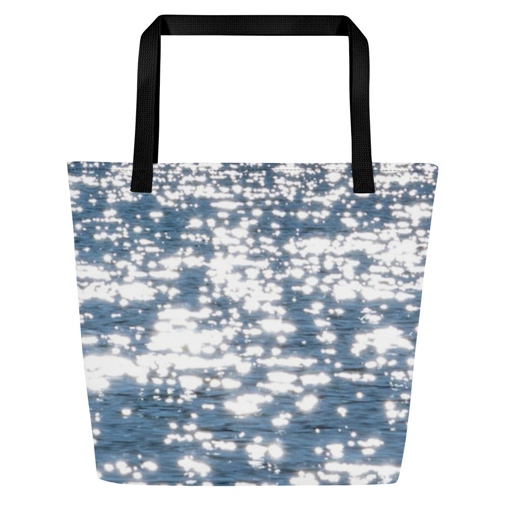 Tote bag with all-over print of bright reflections of the sun on the water, with black handles, one size ready for summer