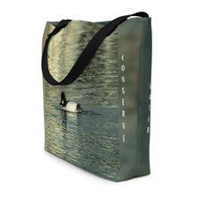 Load image into Gallery viewer, Side view of a  tote bag features a charming baby duck with the message &quot;Conserve Water&quot; written on it, making for a stunning reflection. 
