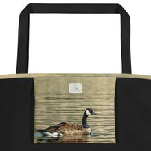 Load image into Gallery viewer, Interior view of tote bag with its respective inner bag printed with a duck swimming in the reflection of the green water.
