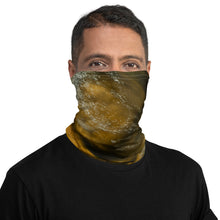 Load image into Gallery viewer, A man wearing a gaiter with an all-over terracotta-colored print, seen from the front side.
