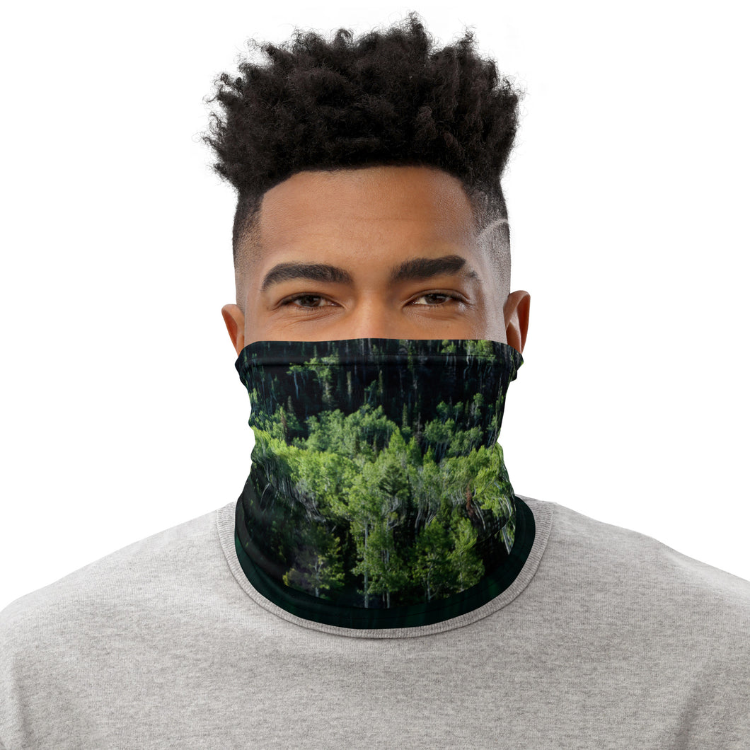 Pando trees reflections, all over print neck gaiter, wearing as a face cover, front side image.