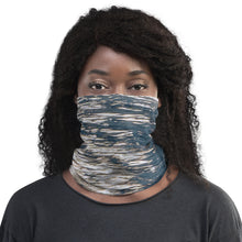 Load image into Gallery viewer, Front view of a neck gaiter modeled by a black woman with beautiful contrasts of gray and blue colors
