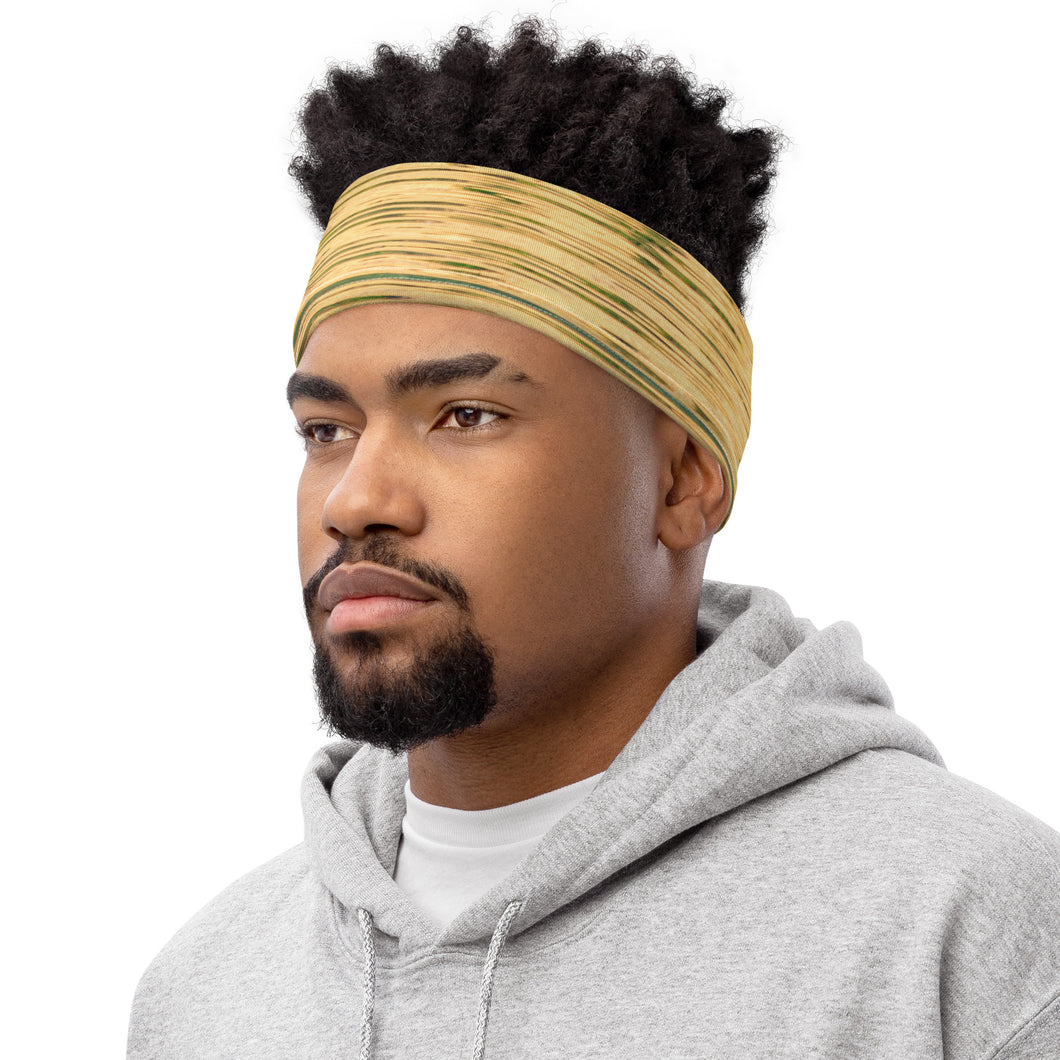 Neck Gaiter Made with a vibrant yellow and green Reflection print, a versatile accessory that can be used with a headband. Shown on a black man