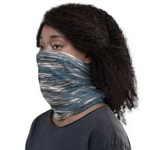 Load image into Gallery viewer, Left side view of a neck gaiter modeled by a black woman with beautiful contrasts of gray and blue colors
