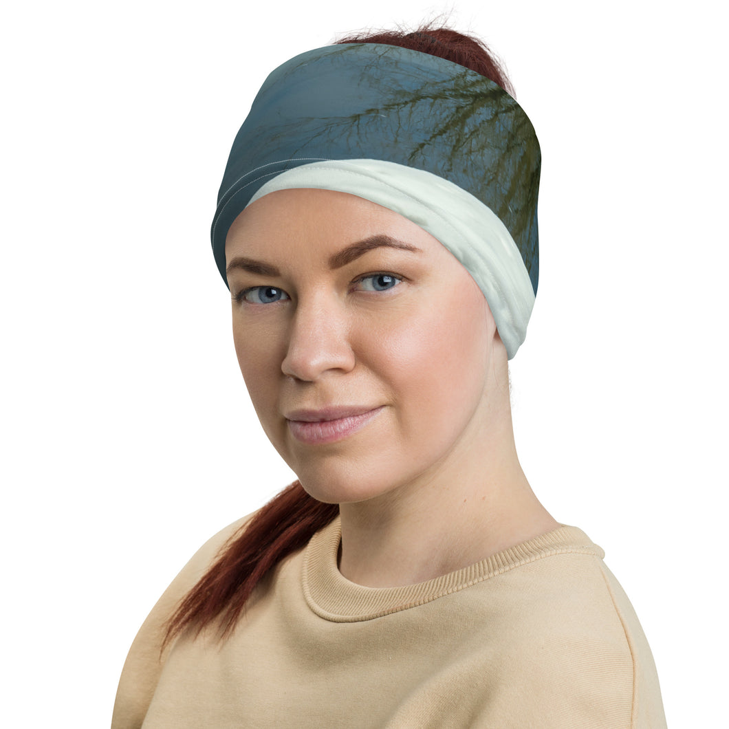 Beautiful neck gaiter with winter colors modeled as headband, front view