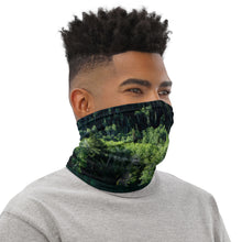 Load image into Gallery viewer, Green colorful Pando trees reflections, all over print neck gaiter, wearing as a face cover.

