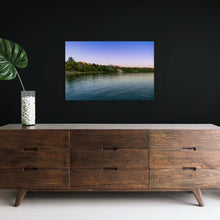 Load image into Gallery viewer, A pic title Beginnin of Autumn in Hyrum Reservoir hanging on black wall contrasting for it brilliant blue and magenta colors.
