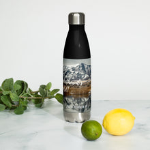 Load image into Gallery viewer, Stainless steel water bottle black 17 oz. On shelf comparing size with 2 limes and mint bouquet. Front side, a cold winter Cutler Reservoir, UT., image and &#39;Sip it Whether It&#39;s hot or cold&#39; printed.
