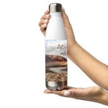 Load image into Gallery viewer, Stainless steel water bottle white 17 oz. On hand, right side view with Colorado River and Let&#39;s go to the extra mile together printed.
