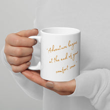 Load image into Gallery viewer, White 11-oz glossy mug with text: &quot;Adventure begins at the end of your confort zone&quot;, handle on right.
