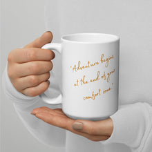 Load image into Gallery viewer, White 15-oz glossy mug with text: &quot;Adventure begins at the end of your confort zone&quot;, handle on right.

