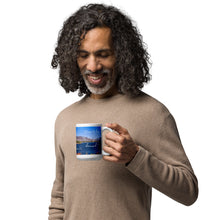 Load image into Gallery viewer, A man with a white glossy 15 oz mug with Pineview Reservoir image, handle on right.
