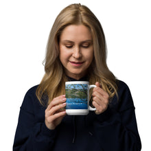 Load image into Gallery viewer, A woman with a white glossy 15 oz mug with Mantua Reservoir image. Handle on right
