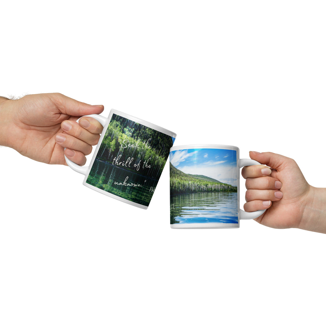 White 20-oz glossy mug with Fish Lake Image, handle on hand with front view.